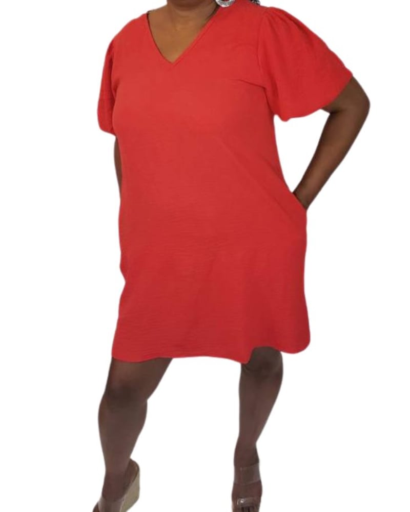 Front of a model wearing a size Large V-Neck Puff Sleeve Mini Dress in Tangerine in Tangerine by A Beauty by BNB. | dia_product_style_image_id:346339